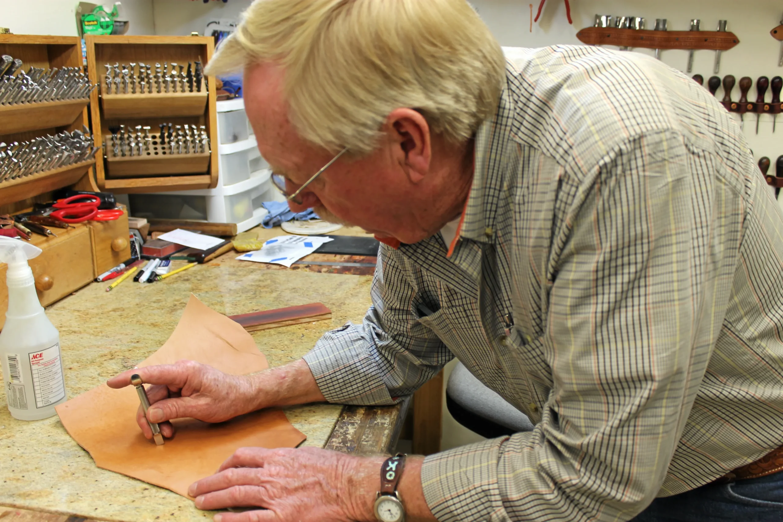 Gene Kirkendall teaching a leatherworking workshop